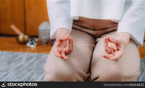 Meditating woman. Peaceful woman sitting and meditating.. Peaceful Woman Meditating