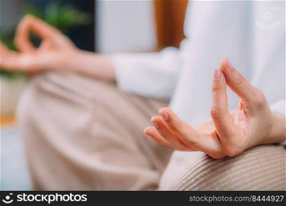 Meditating woman. Peaceful woman sitting in a lotus position and meditating.  . Peaceful Woman Meditating, Sitting in Lotus Position.