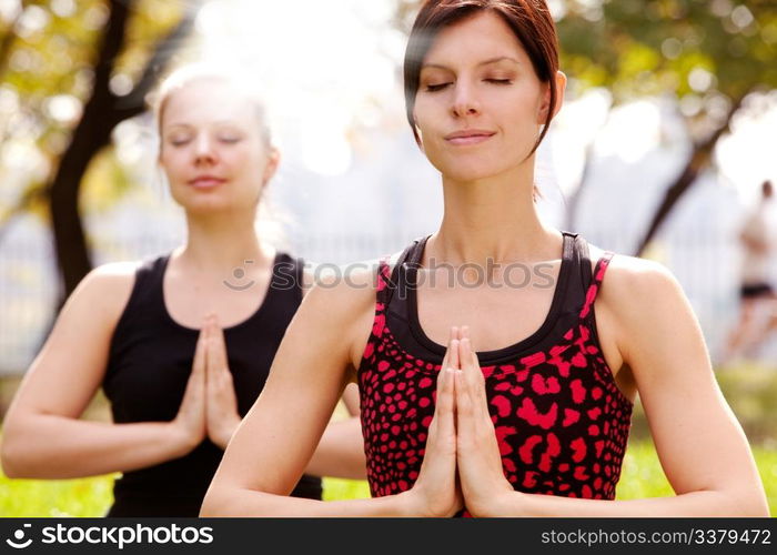 Meditation in the a park on a warm summer day