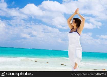 meditation of happy woman on the beach