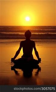 Meditation on the beach at sunset