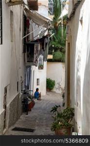 Mediterranean alley way between old houses and buildings