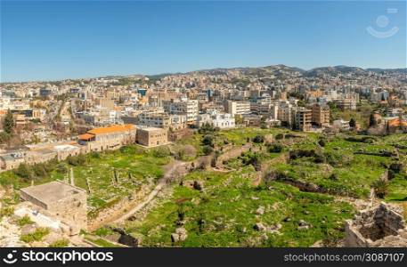 Mediterranean city downtown panorama with crusaider castle ruins in the foreground, Jbeil, Biblos, Lebanon