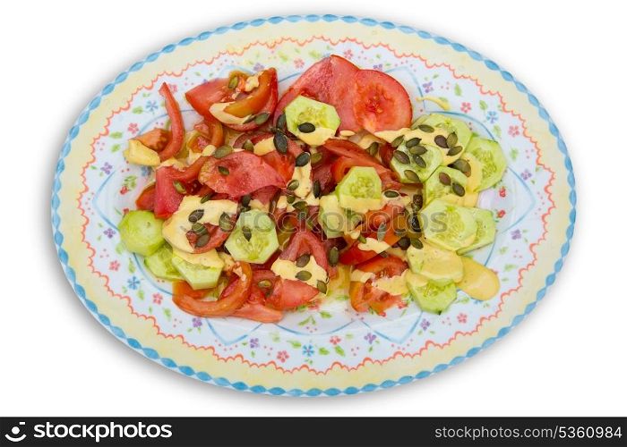 Mediterranean salad with tomato cucumber pumpkin seeds and sauce