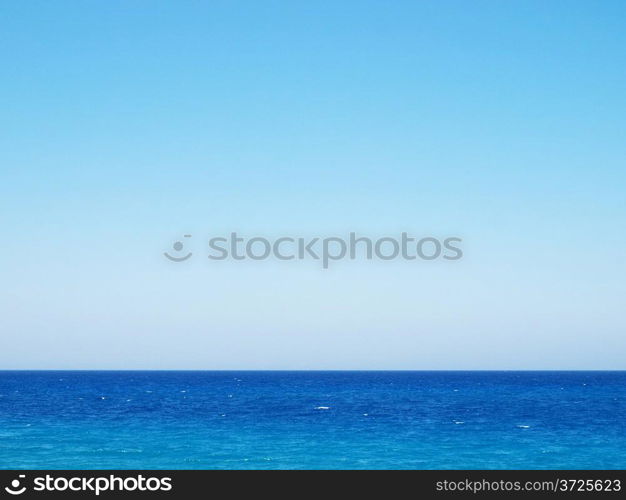 Mediterranean Sea. Clear wavy water surface and clear blue sky.