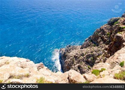 Mediterranean sea foam rocky shore in formentera Barbaria cape