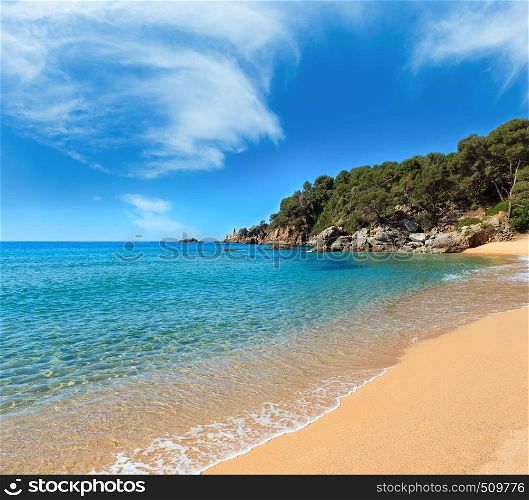 Mediterranean sea rocky coast summer view with sandy beach (Costa Brava, Catalonia, Spain).