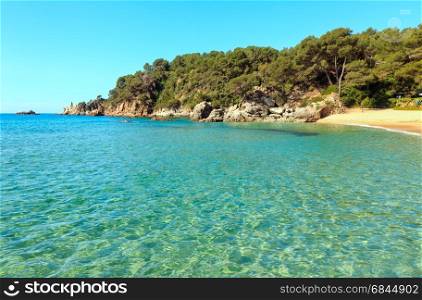 Mediterranean sea rocky coast summer view with sandy beach (Costa Brava, Catalonia, Spain.