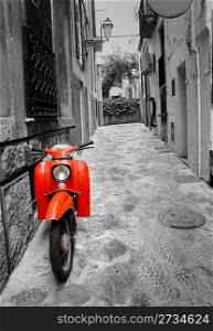 Mediterranean street with old retro red scooter in Palma de Mallorca Spain