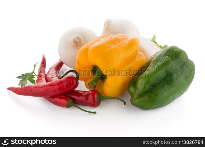 Mediterranean vegetables with red chilli peppers, parsley and bell peppers isolated on white background.
