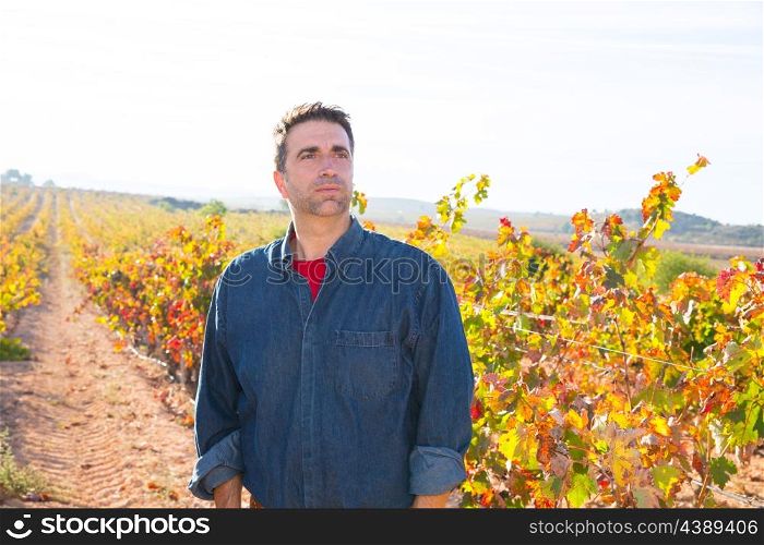 Mediterranean vineyard farmer relaxed looking wines grape field in Spain