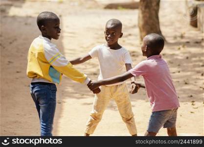 medium shot african boys playing together