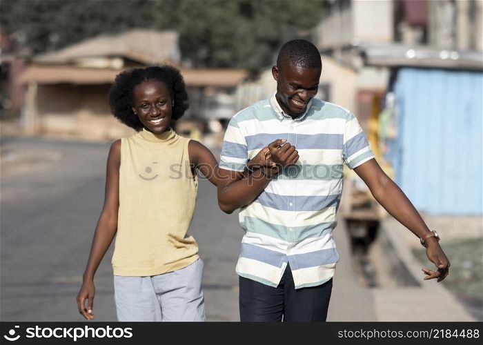 medium shot african couple holding hands