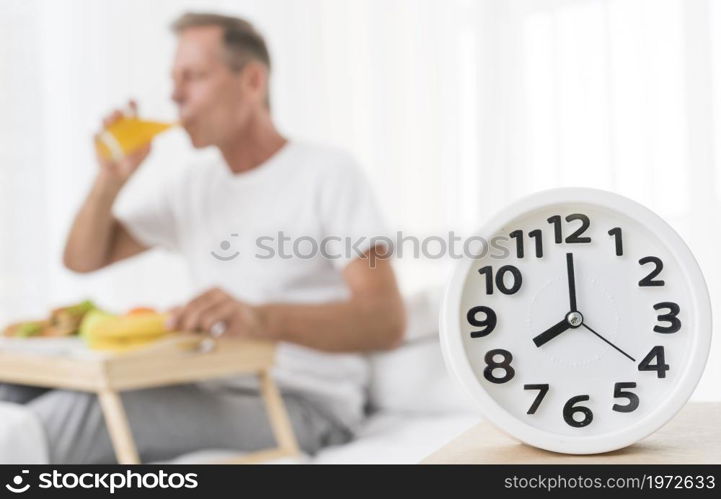 medium shot blurred man having breakfast 8 m. High resolution photo. medium shot blurred man having breakfast 8 m. High quality photo