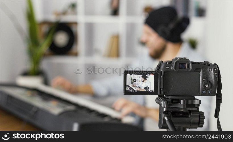 medium shot blurry man recording himself