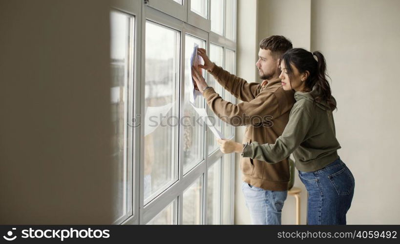 medium shot couple holding plan