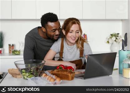medium shot couple with laptop