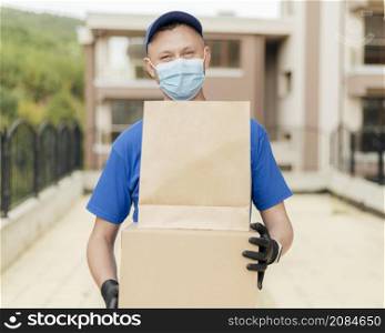 medium shot delivery man wearing mask