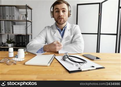 medium shot doctor holding pen