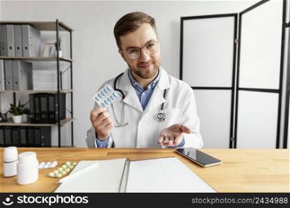 medium shot doctor holding pills 3