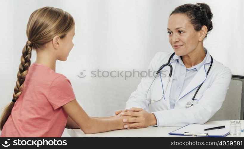 medium shot doctor talking kid