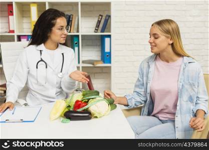 medium shot doctor talking patient about vegetables