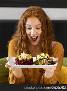 medium shot excited woman with food plate