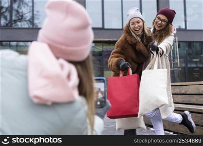 medium shot friends with shopping bags