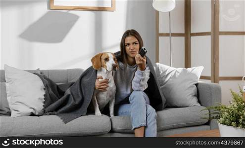 medium shot girl dog watching tv