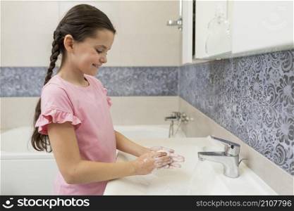 medium shot girl washing hands