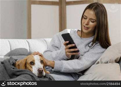 medium shot girl with phone dog