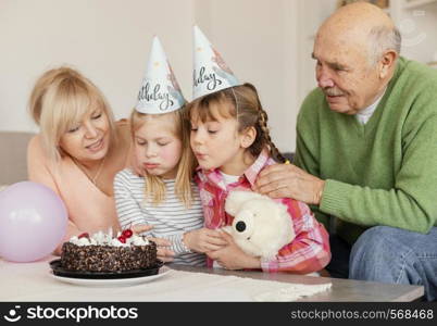 medium shot girls blowing candles