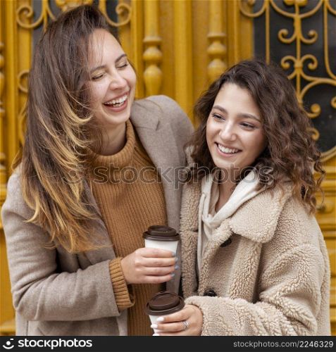 medium shot happy women with coffee