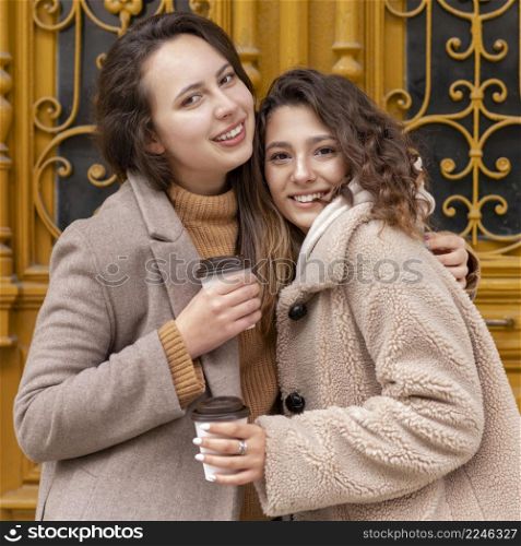 medium shot happy women with coffee cups 3. medium shot happy women with coffee cups 2
