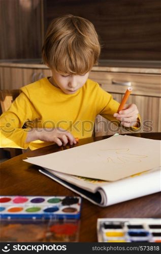 medium shot kid holding marker