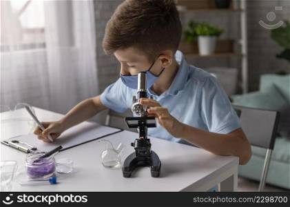 medium shot kid learning with microscope