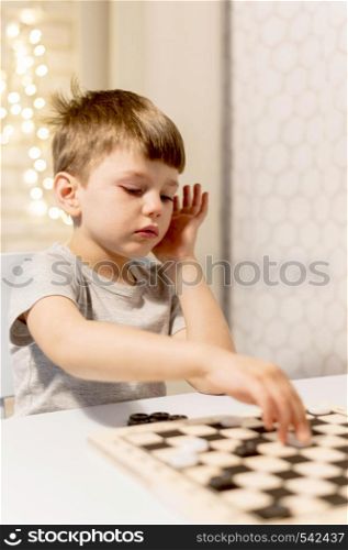 medium shot kid playing chess