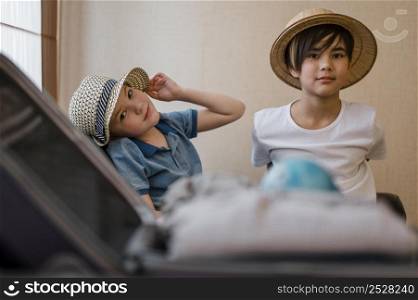 medium shot kids with folded clothes 2