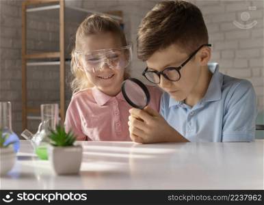 medium shot kids with magnifying glass