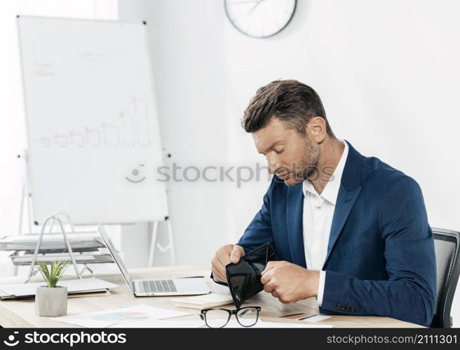 medium shot man checking empty wallet