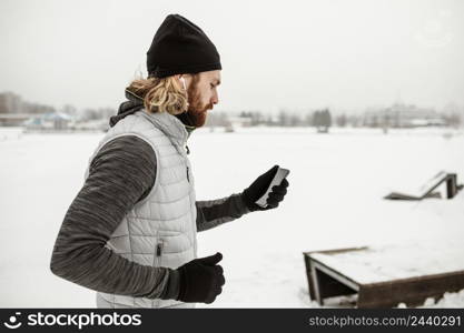 medium shot man checking phone