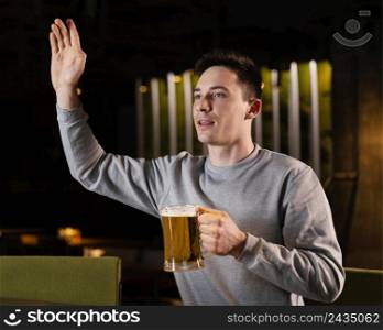 medium shot man holding beer mug