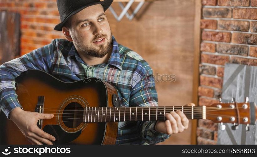 medium shot man holding guitar 3