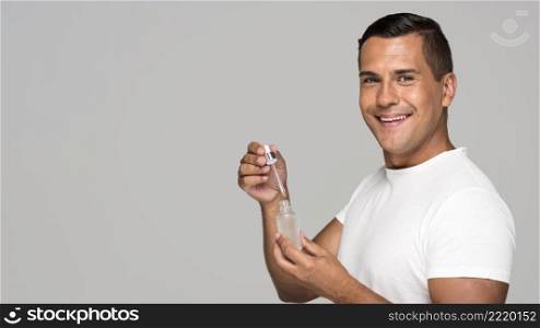 medium shot man holding serum