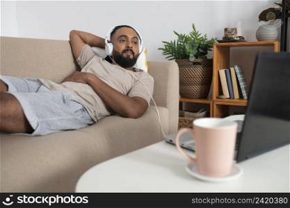 medium shot man laying couch