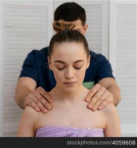 medium shot man massaging woman