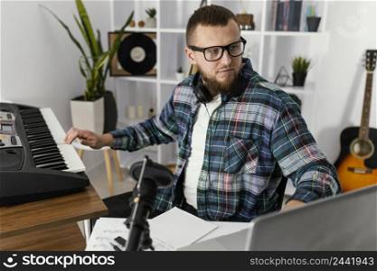 medium shot man playing piano