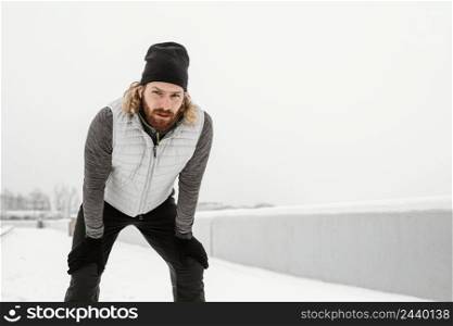 medium shot man posing outdoors