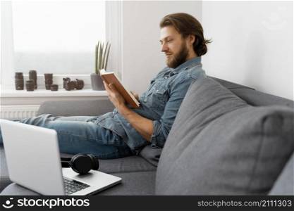 medium shot man reading book
