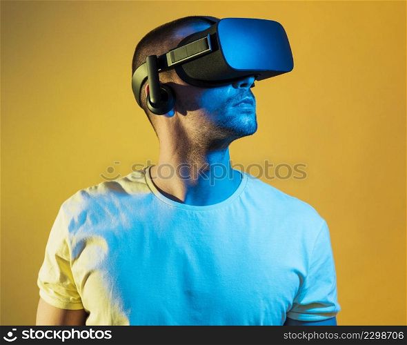 medium shot man wearing virtual reality gadget